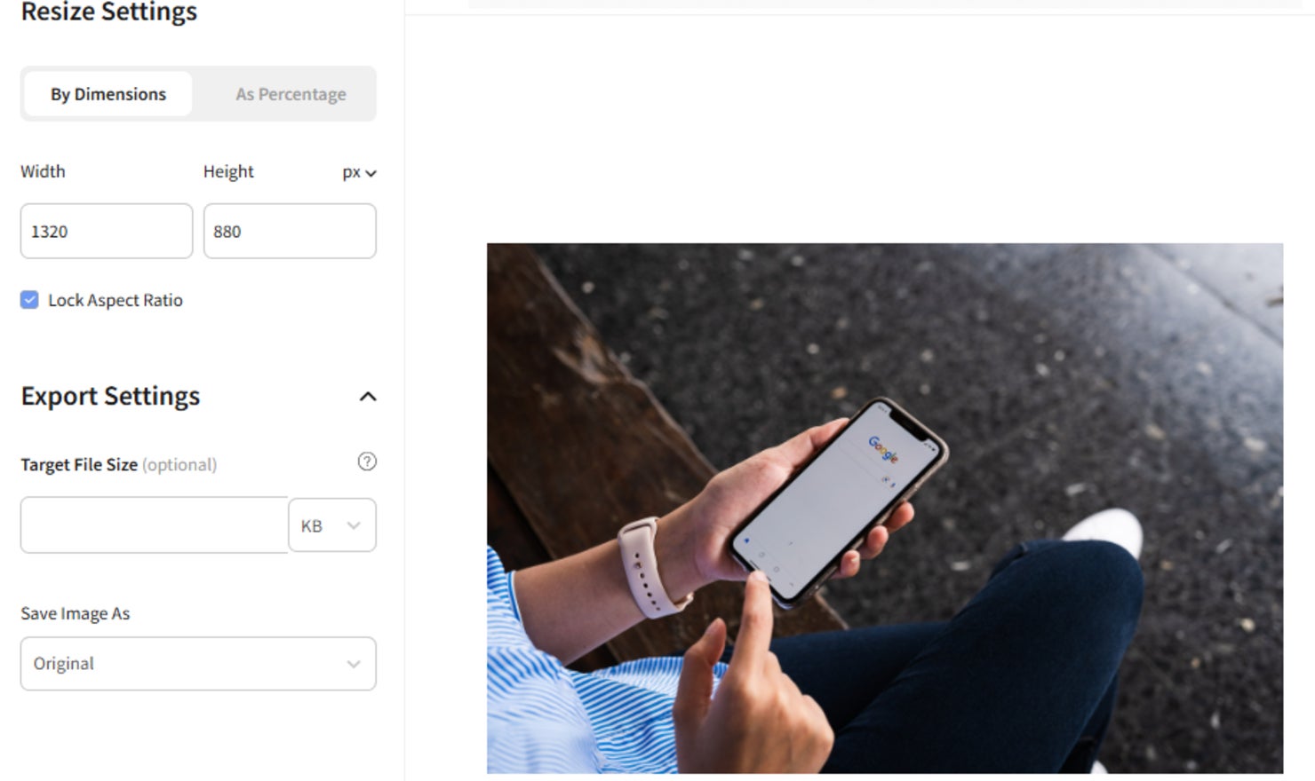 Promote Your Website Image Resizer image of a person looking at their phone being resized with the image resizer tool