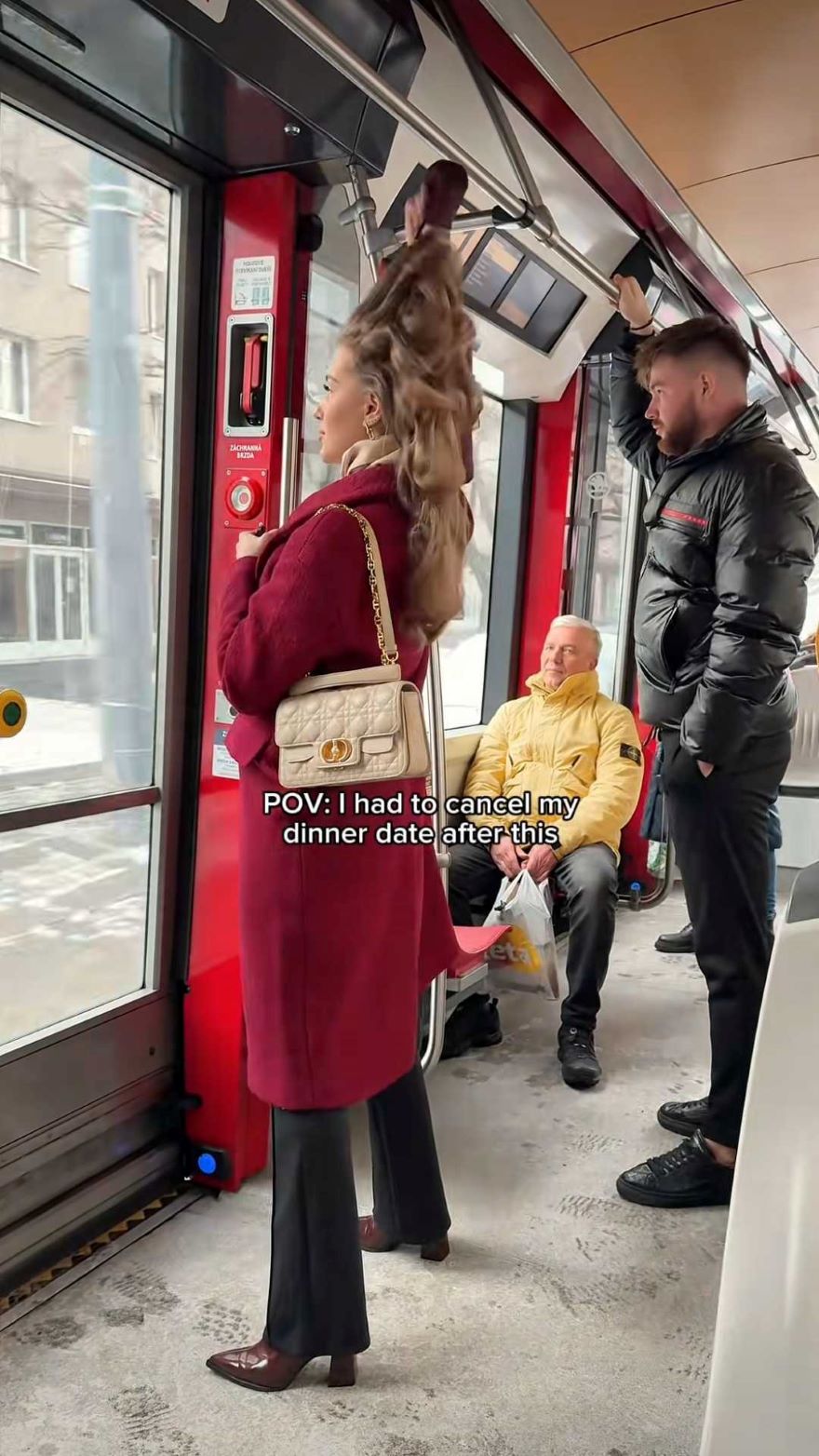 A TikTok screenshot of a woman on a bus taking out heatless hair curlers
