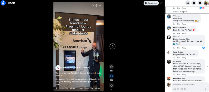 American Airlines Reels Entertaining A staff member presents a drink in front of the American Airlines Flagship Lounge signage, adorned with flowers.