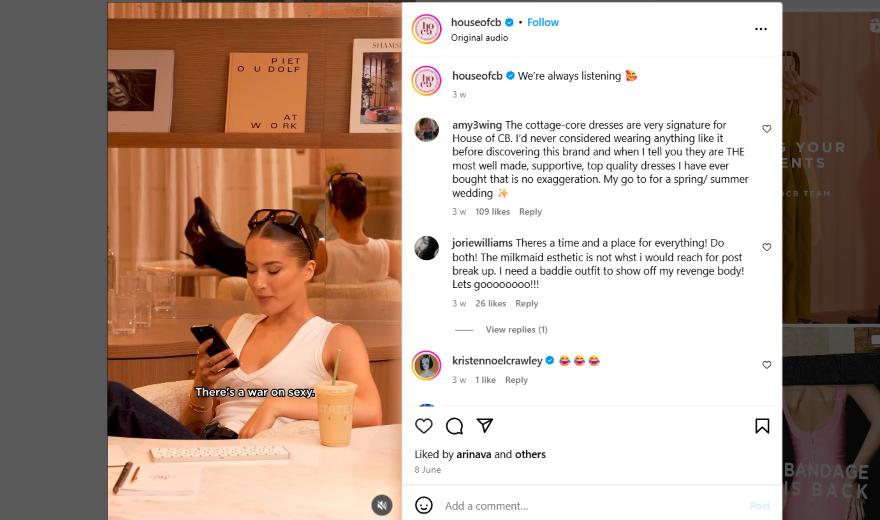 House of CB Responding to Comments Instagram video of a woman in a white tank top sitting at her desk looking at her phone.